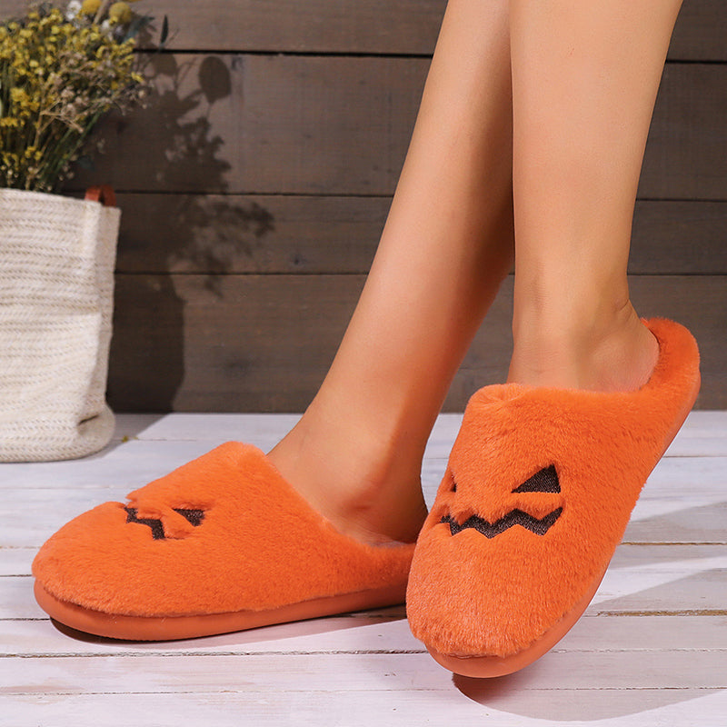 Cute pumpkin slippers for winter with plush material and playful pumpkin design, perfect for cozy indoor wear.
