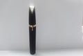 Portable eyebrow trimmer with LED light showing the compact grooming device